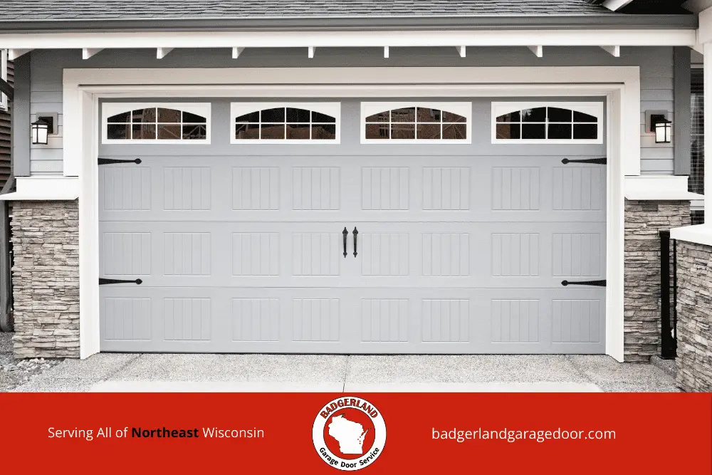 A modern garage door with stone accents, promoting Bestland Garage Door Repair services in Appleton and Green Bay.| Bestland Garage Door Service – Green Bay Garage Door Repair