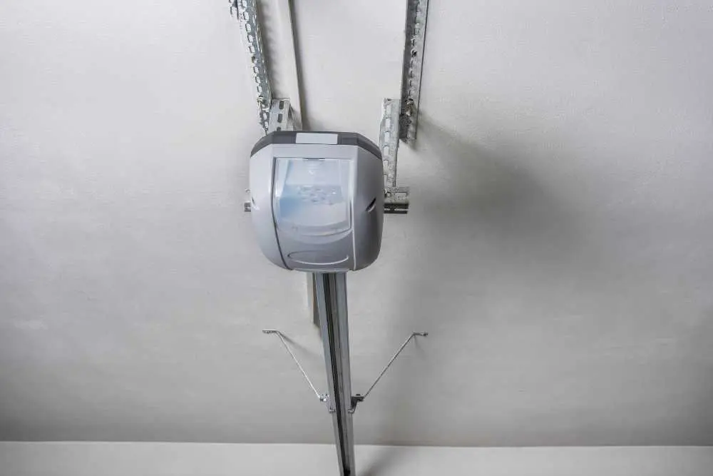 A sleek, modern garage door opener is mounted on a ceiling track, showcasing the advanced technology used in garage door repair services offered in Green Bay and Appleton.| Bestland Garage Door Service – Green Bay Garage Door Repair