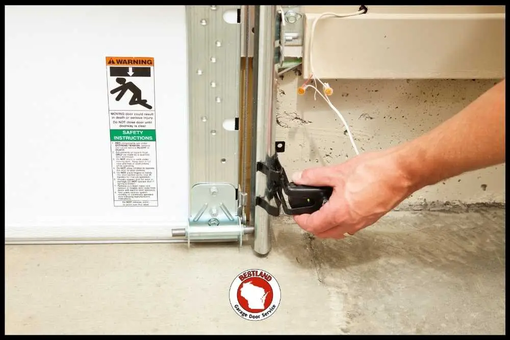 Garage door tune-up signs to watch for during summer heat