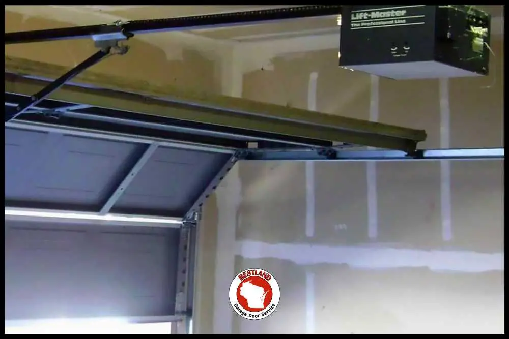 Garage door maintenance safety inspection for opener sensors and balance